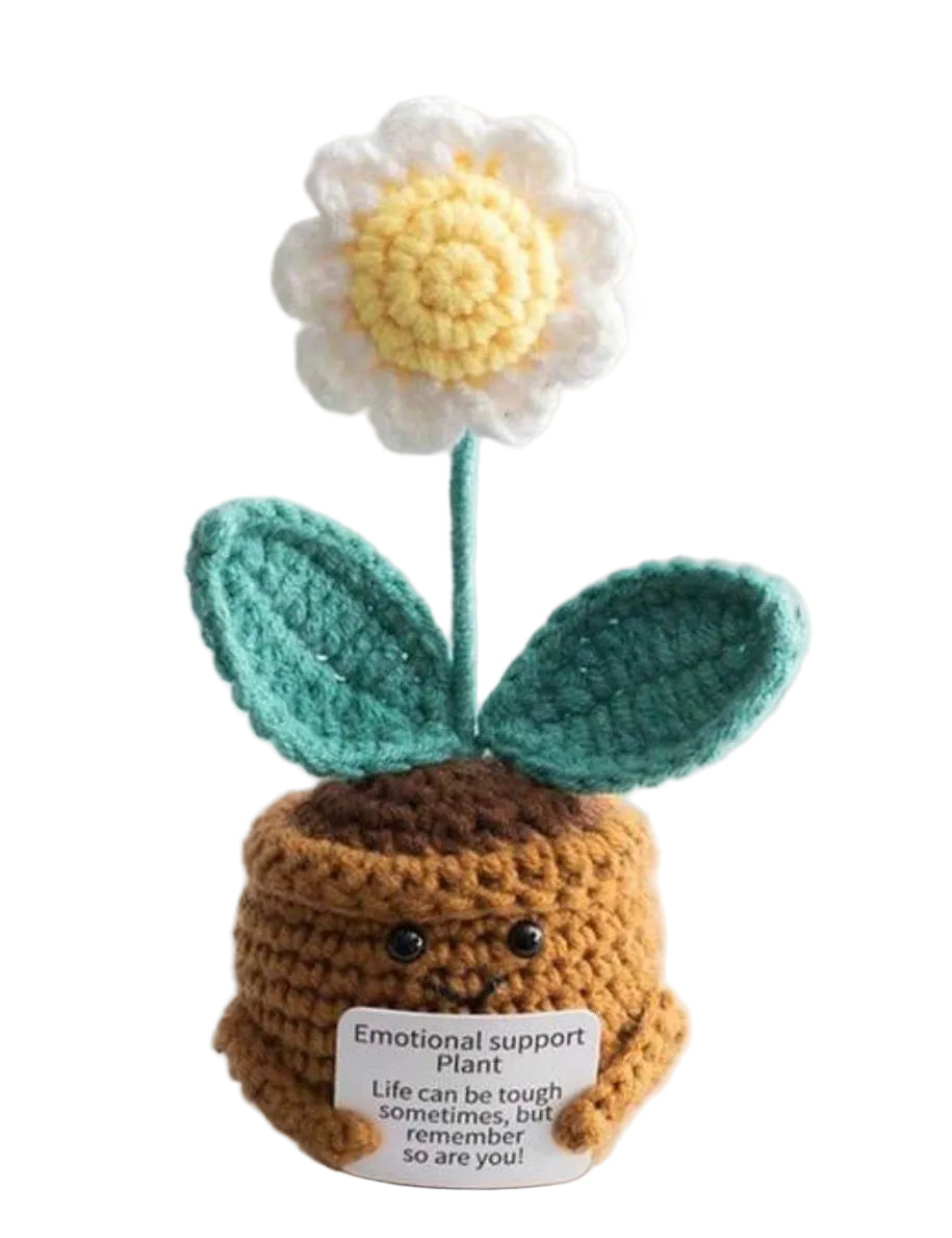 Crocheted emotional support plant with a flower on a white background