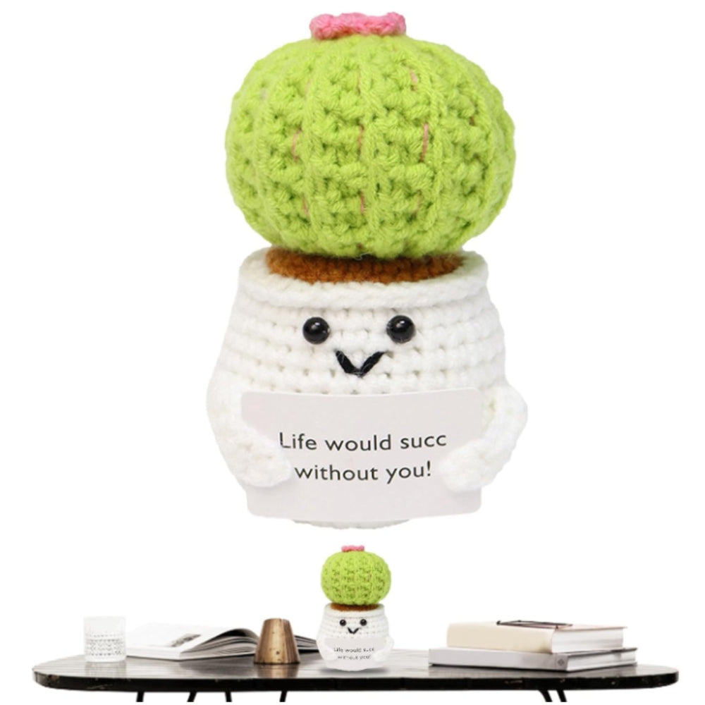 Knitted cactus plant with a small pot and a message on a white background