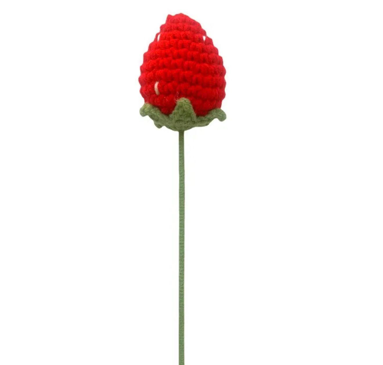 Red crocheted flower on a white background