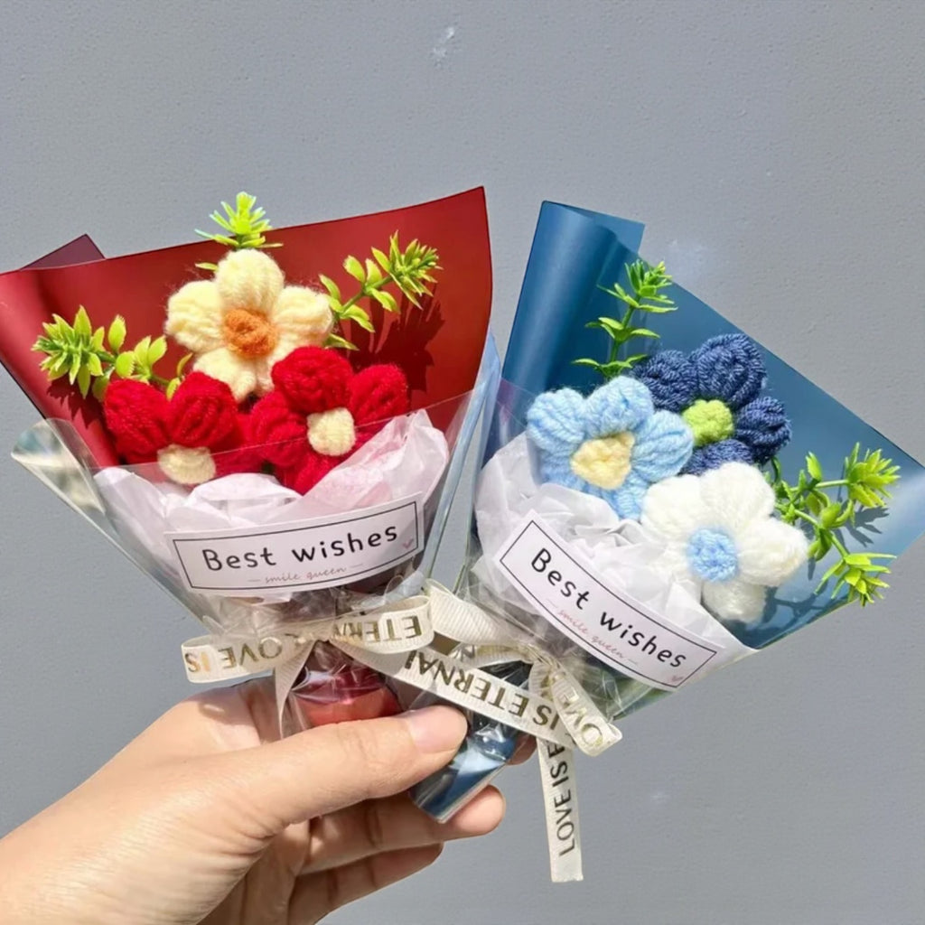 Two bouquets of knitted flowers labeled 'Best wishes' held by a hand against a gray background.