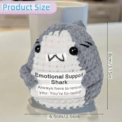 Plush toy shark with text 'Emotional Support Shark' and measurements on a white background