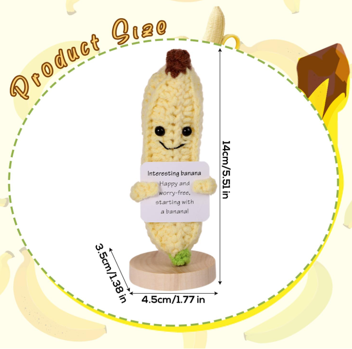 Toy banana with a smiley face and dimensions on a white background