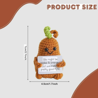 Crocheted carrot plush toy with measurement details on a white background