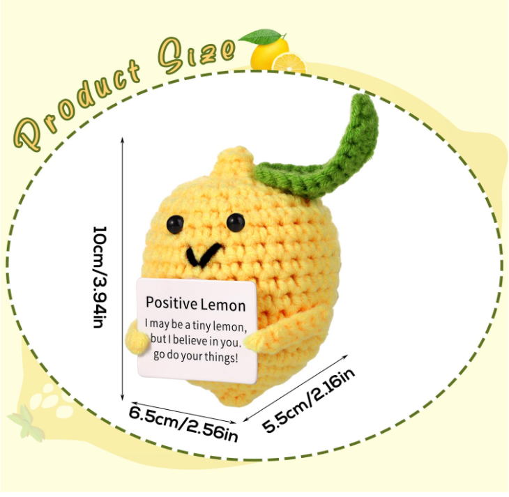 Crocheted lemon character holding a sign with text, surrounded by measurement details on a yellow background.