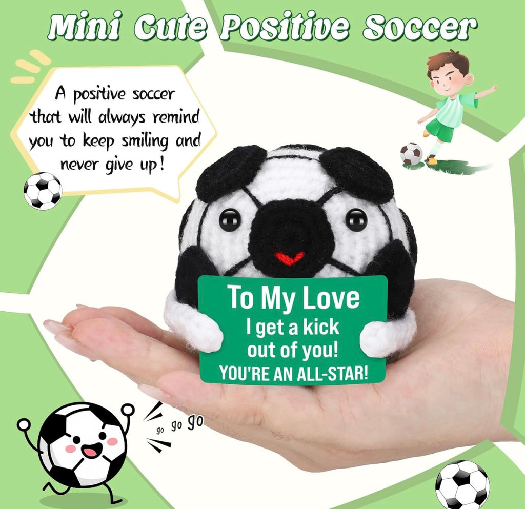 Plush soccer ball with a message card held in a hand, surrounded by soccer-themed graphics and text.